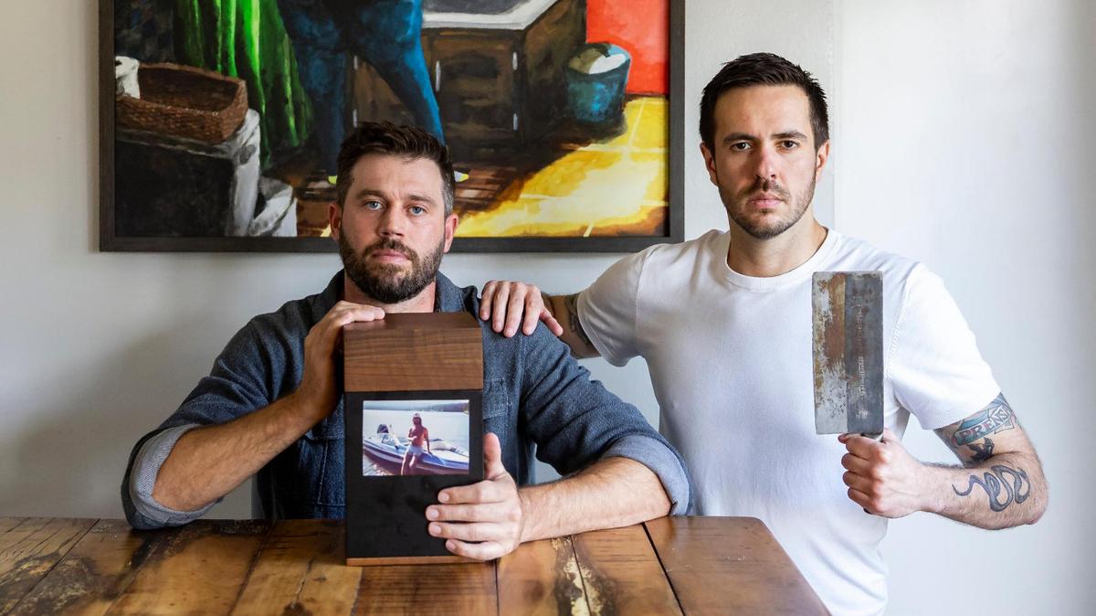 David Zarco, 36, right, and his roommate with a box containing the ashes of the roommate’s late uncle Greg. Zarco prepares uncle Greg’s recipes on their TikTok account called “Dead Greg’s Recipes.”