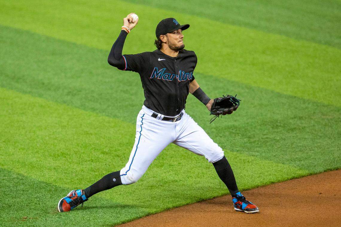Miami Marlins infielder Miguel Rojas (19) throws the ball to first base during the first inning of a Major League Baseball game against the Philadelphia Phillies at Marlins Park in Miami, Florida on Saturday, September 12, 2020.