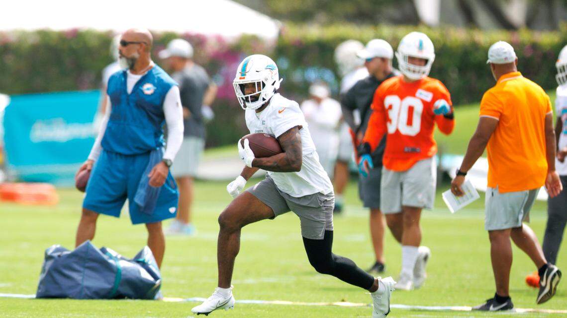 Miami Dolphins running back Raheem Mostert (31) runs with the football during NFL football training camp at Baptist Health Training Complex in Hard Rock Stadium on Wednesday, July 27, 2022 in Miami Gardens, Florida.