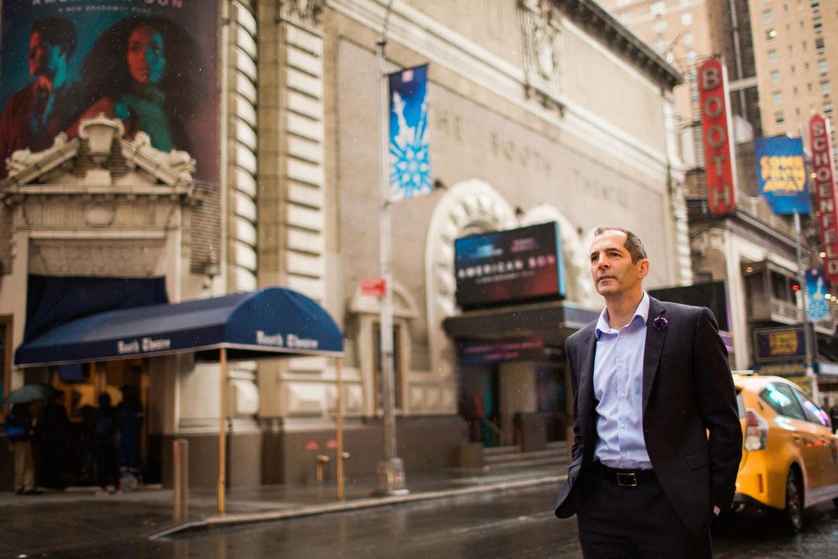 Miami playwright Christopher Demos-Brown walks past the Booth Theatre, where his play “American Son” is running on Broadway through Jan. 27.