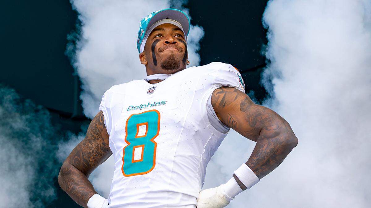 Miami Dolphins safety Jevon Holland (8) takes the field during the introduction ceremony before the start of their NFL game against the New York Jets at Hard Rock Stadium on Sunday, Dec. 8, 2024, in Miami Gardens, Florida.