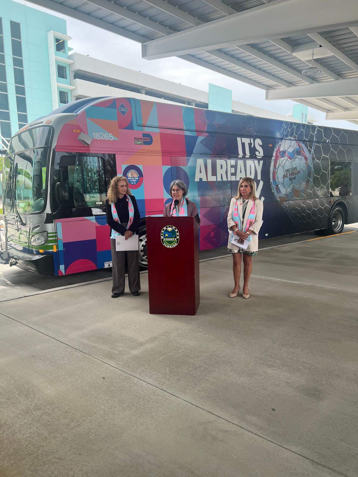 Mayor Daniella Levine Cava, (center, detailed the county’s plans to provide free shuttle bus service ahead of the FIFA World Cup matches that will be held at Miami Gardens’ Hard Rock Stadium from June 15 to July 18. Cava, on June 1, 2026, at the Golden Glades Multimodal Transit Station, was joined by (left) Department of Transportation and Public Works director and CEO Stacy L. Miller and (right) FIFA World Cup 26 Miami Host Committee President and CEO Alina T. Hudak.