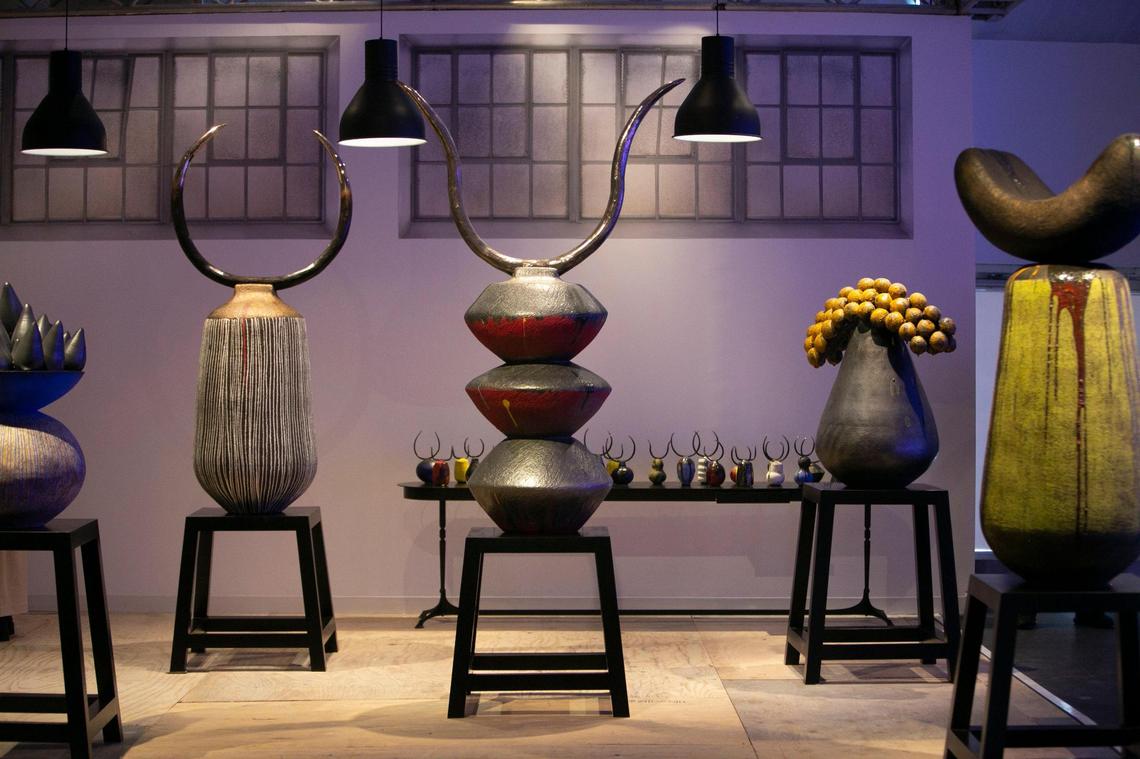 Zizipho Poswa ceramic sculptures with bronze cattle horns attached are on display at the South African Gallery at Design Miami/.
