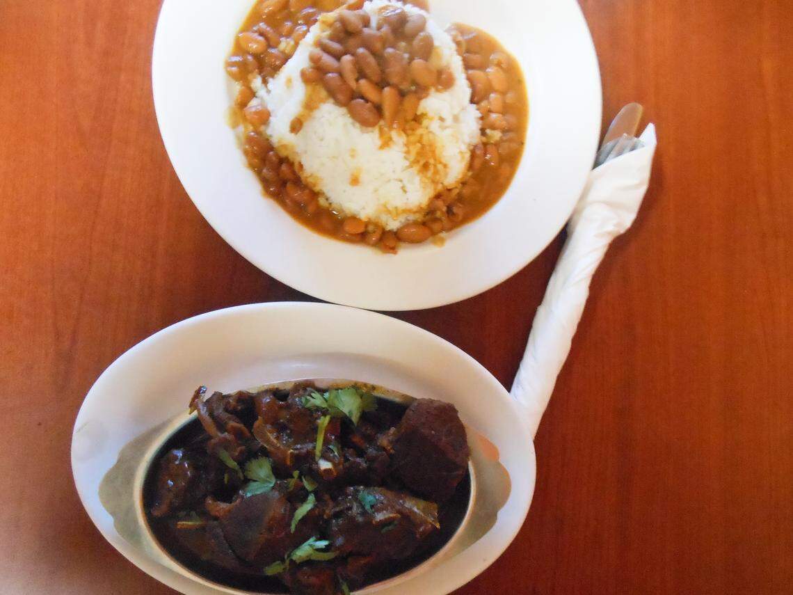 Stewed goat with rice and beans at Mangu Dominican restaurant in Hialeah.