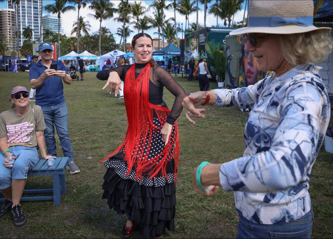 Flamenco dancer Monika Lange with Luna Cale USA, center, dances with Tara Garcia, 81, right, during her performance at the 62nd Coconut Grove Arts Festival. Centered at Regatta Park in Dinner Key Marina overlooking Biscayne Bay, the festival spanned McFarlane Road, Pan American Drive and South Bayshore Drive, where the works of more than 275 artists were on display on Sunday, February 15, 2026, in Miami, Florida. 