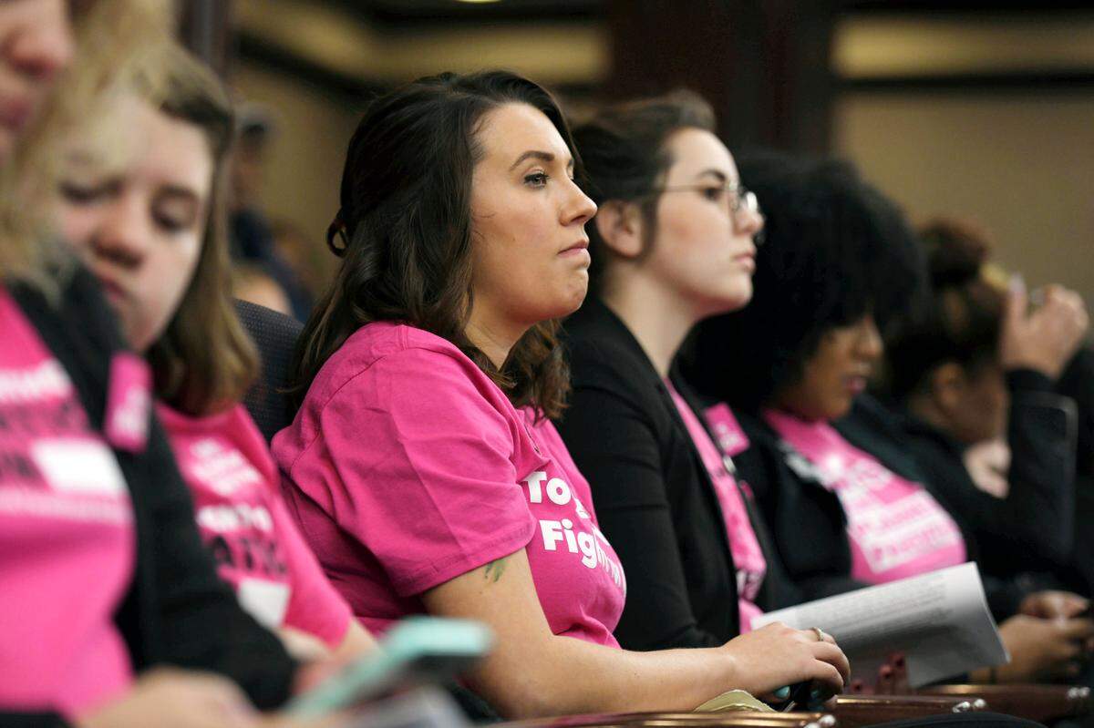 Attendees listen during a state Senate Rules Committee hearing regarding SB 404, known as the “parental consent” bill, at the Capitol Wednesday in Tallahassee. The bill , which requires girls under the age of 18 get a parent’s consent before having an abortion, was approved Wednesday in its final committee stop.