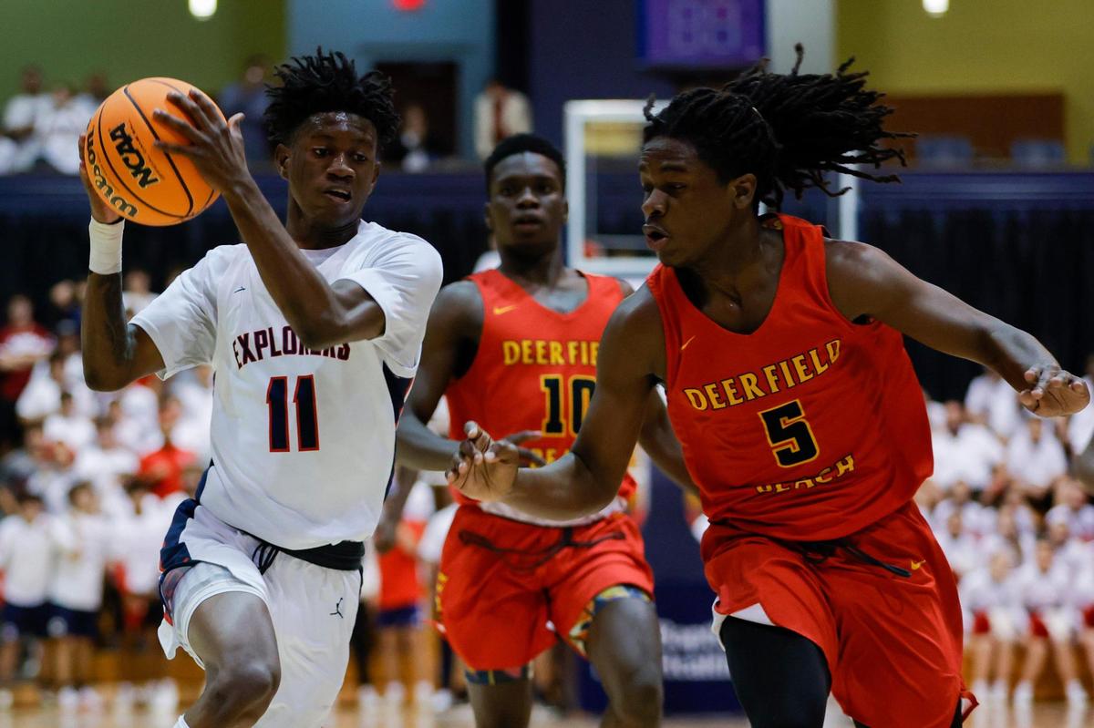 Columbus guard Garyn Bess (11) drives to the basket during the first half of the basketball regional final against Deerfield Beach at the Ocean Bank Arena at Florida International University in Miami, Florida, Friday, February 24, 2023.