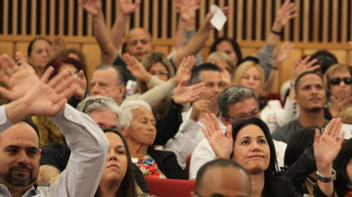 The crowd reacts during a November 2014 meeting of the Miami-Dade County Commission. Members of the commission are subject to a two-term limit under the county's charter, but there's a proposal to lift those restrictions before they force any commissioners to leave office.