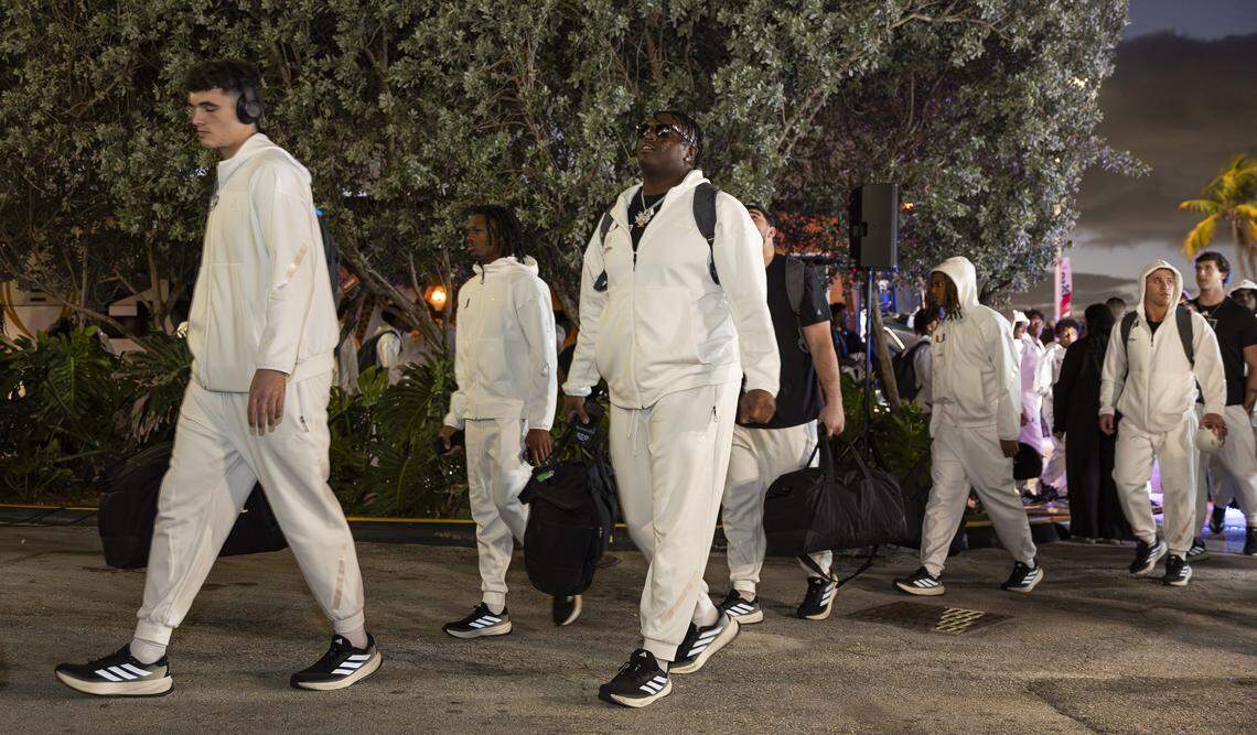 Miami Hurricanes offensive lineman Matthew McCoy (78) arrives with his teammates to the Fontainebleau Miami Beach ahead of their College Football Playoff National Championship Game against the Indiana Hoosiers on Friday, Jan. 16, 2026, in Miami Beach, Fla.