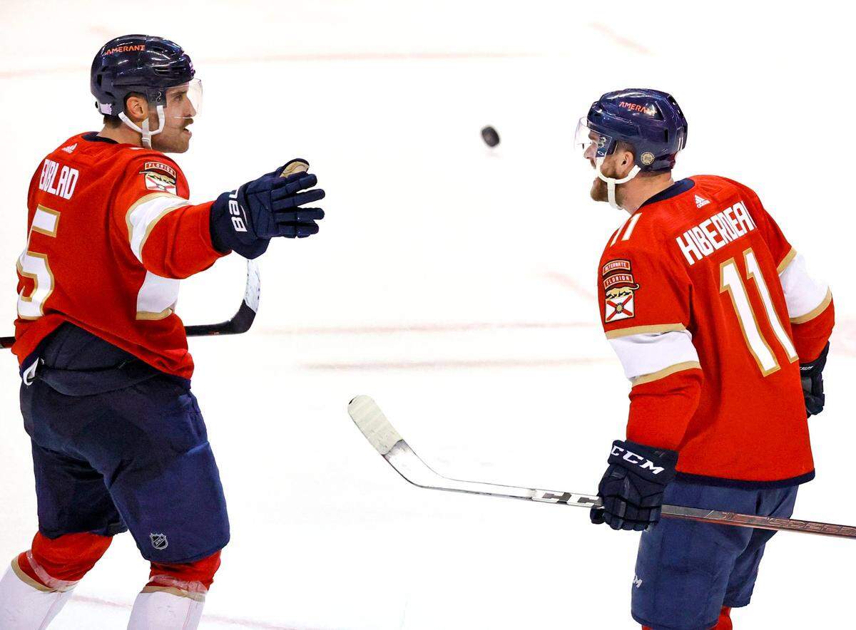 Florida Panthers defenseman Aaron Ekblad (5) celebrate with Jonathan Huberdeau (11) after scoring the winning goal against the Philadelphia during overtime of an NHL game at the FLA Live Arena on Wednesday, November 24, 2021 in Sunrise, Fl.