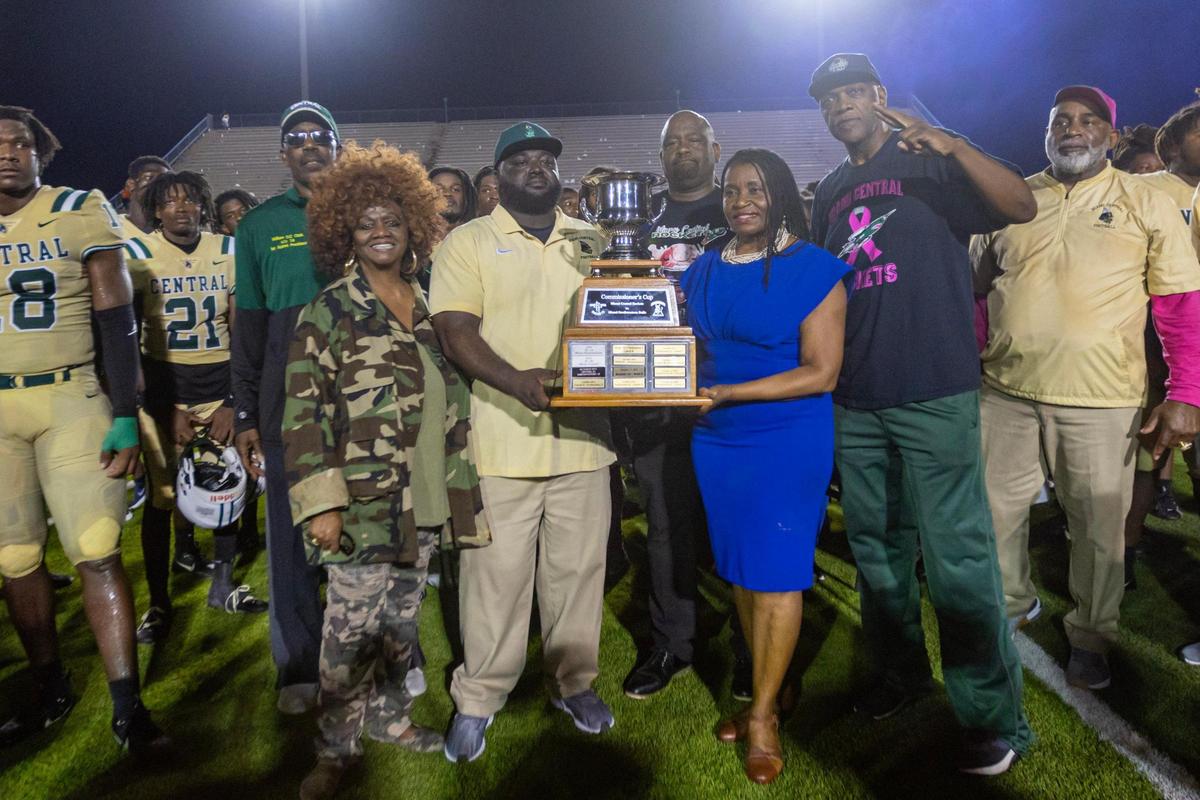 Miami Central Head Coach Jube Joseph is presented the Commiosner Cup after defeating Northwestern 17-10 during a high school football game at Traz Powell in Miami, Florida, on Friday, October 6, 2023.