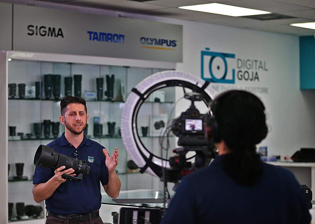 Isis Iglesias (right), films fellow Digital Goja co-host Adam Barkan as they discuss new gear at the Miami offices of the tech company on Tuesday, October 9, 2018.