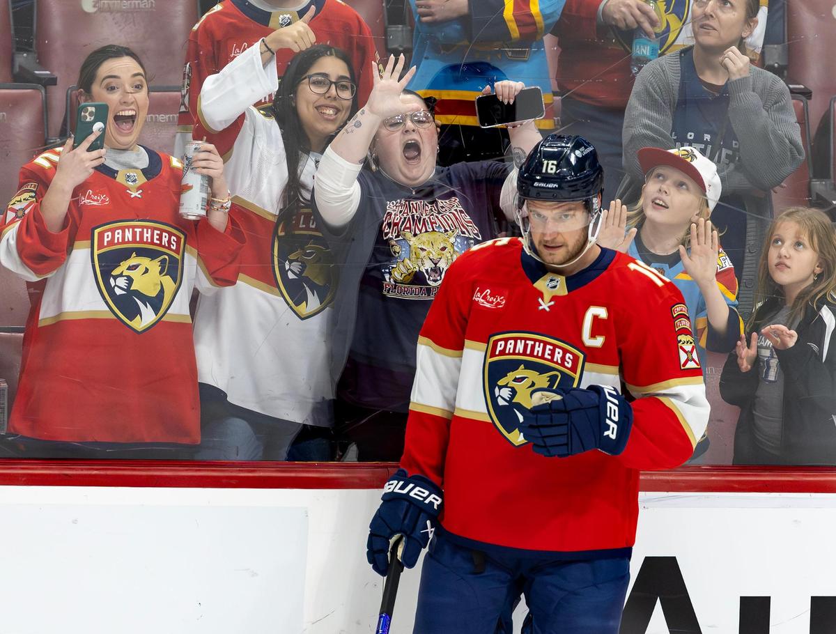 Florida Panthers center Aleksander Barkov (16) looks on as fans display their support for the team before the start of an NHL game against the St. Louis Blues at Amerant Bank Arena on Friday, Dec. 20, 2024, in Sunrise, Fla.