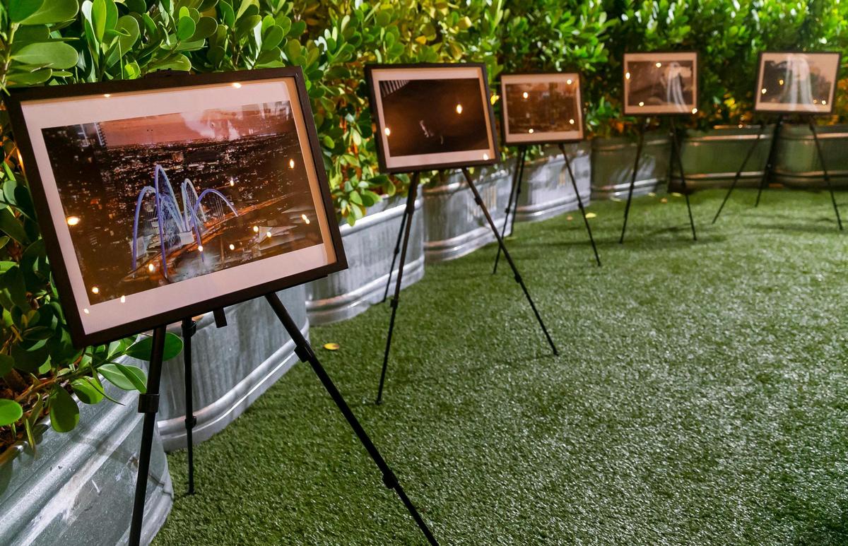 Photos are up for sale during The Smile Trust’s “Smile Fuh Me” event hosted at the N’Namdi Contemporary Fine Art Gallery in Miami’s Little Haiti neighborhood on Sunday, Dec. 5, 2021.