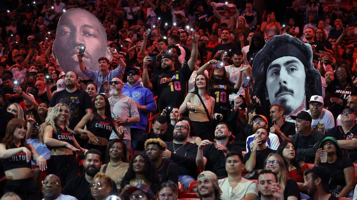 NBA fans dance in the stands during the game between the Miami Heat and the Dallas Mavericks at the Kaseya Center in Miami on Wednesday, April 10, 2024.