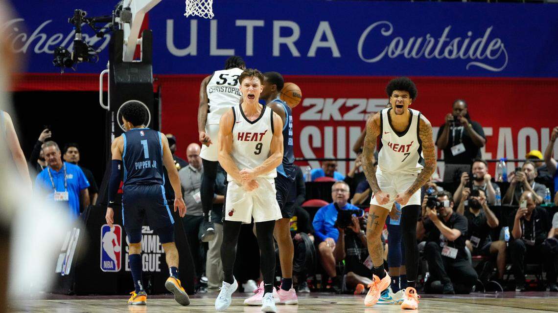 Miami Heat guard Pelle Larsson (9) reacts with center Kel’el Ware (7) after scoring against the Memphis Grizzlies during the overtime at Thomas & Mack Center.