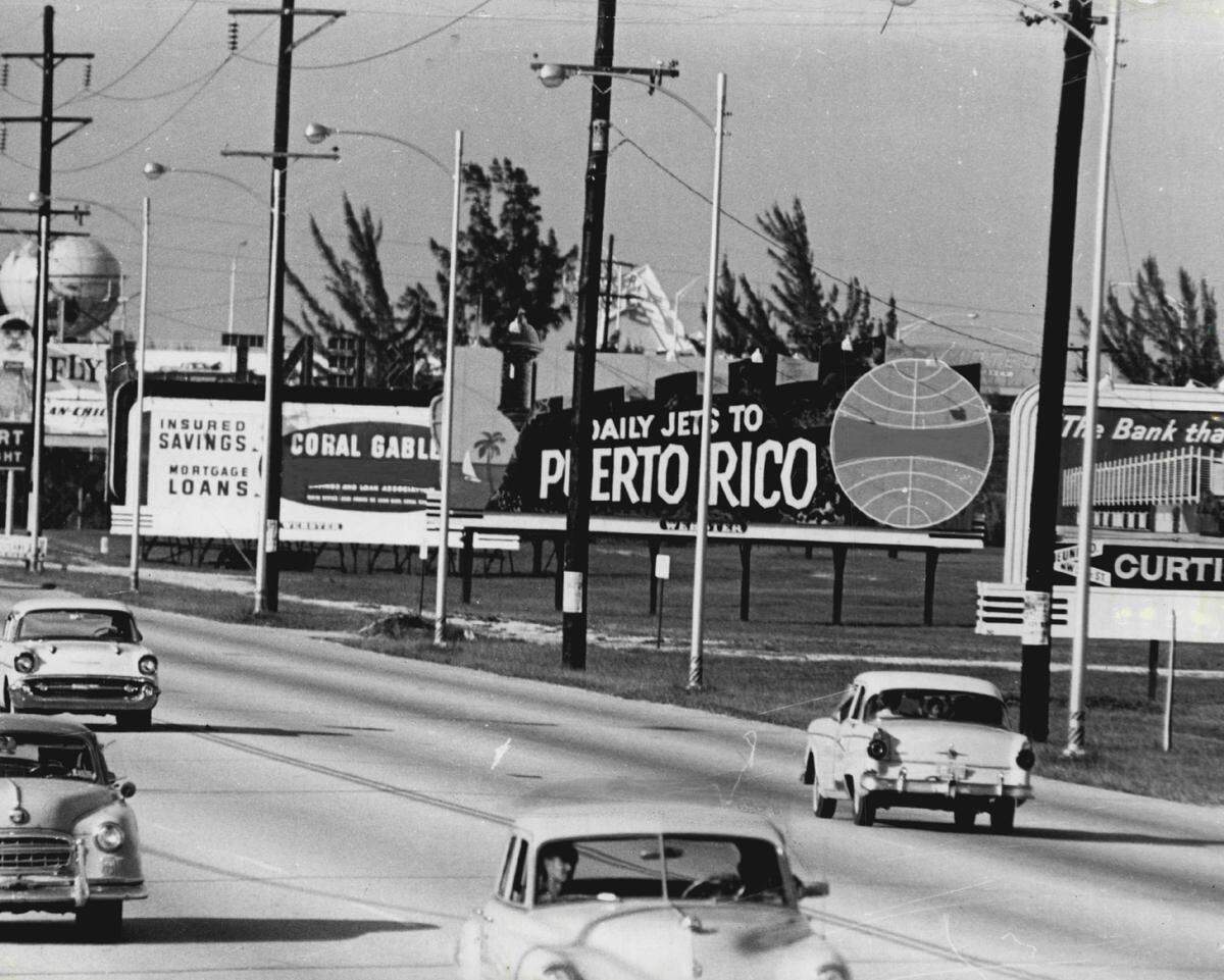A lineup of billboards near Miami International Airport in 1961.