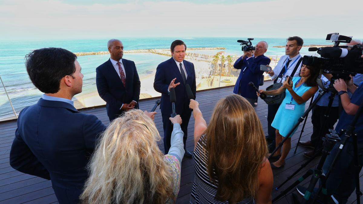 With the Mediterranean Sea as a backdrop, Gov. Ron DeSantis speaks to reporters ahead of the first full day of a Florida trade delegation trip to Israel.