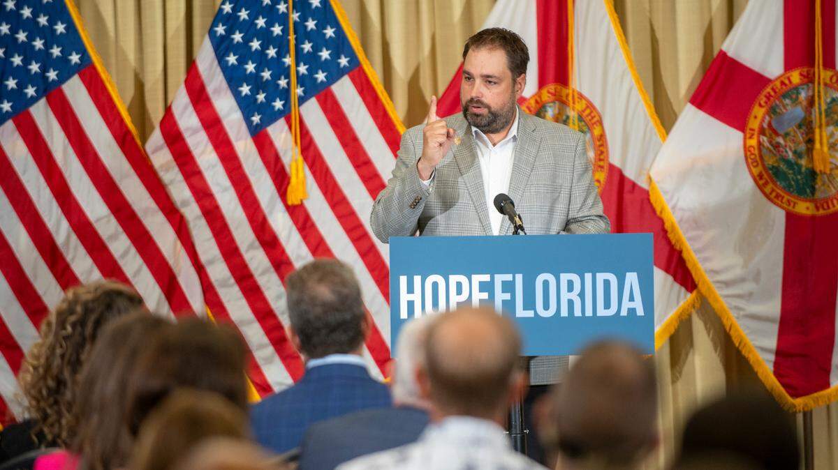 Erik Dellenback, who resigned as executive director of Hope Florida on Wednesday, speaks during a press conferance on July 29, 2024 in Tampa, Fl. During the conference, Florida Governor Ron Desantis and First Lady Casey DeSantis handed out multiple checks to local churches, as a part of their Hope Florida program.