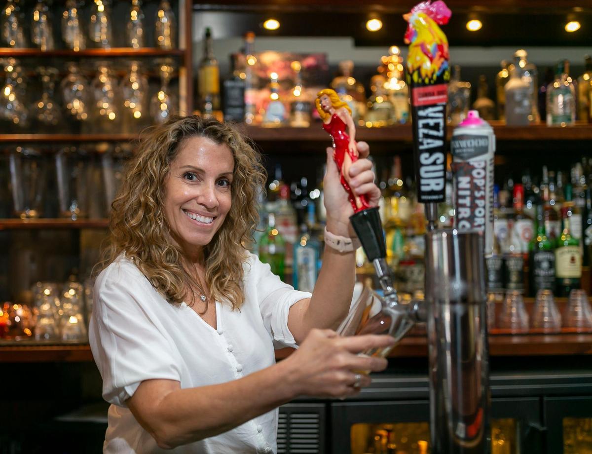 Kim Murdock works from her bar The Mighty in Miami’s Silver Bluff neighborhood. Murdock bought The Mighty just before the pandemic started.