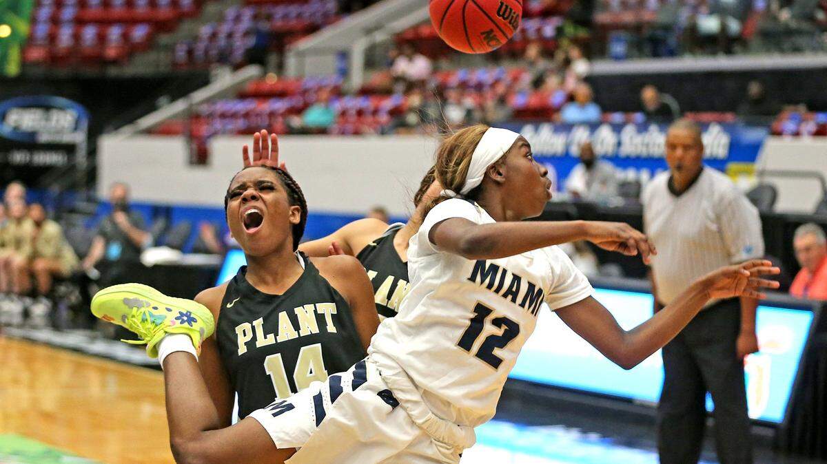 Miami High Janay Quinn (12) and Plant HS Nyla Jean (14) in the FHSAA Girls Basketball 7A Finals in Lakeland, Florida, Saturday, February 27, 2021.