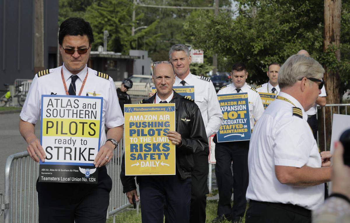 Atlas Air pilots who fly planes for Amazon.com picket outside Amazon.com’s annual shareholders meeting, Wednesday, May 22, 2019, in Seattle.