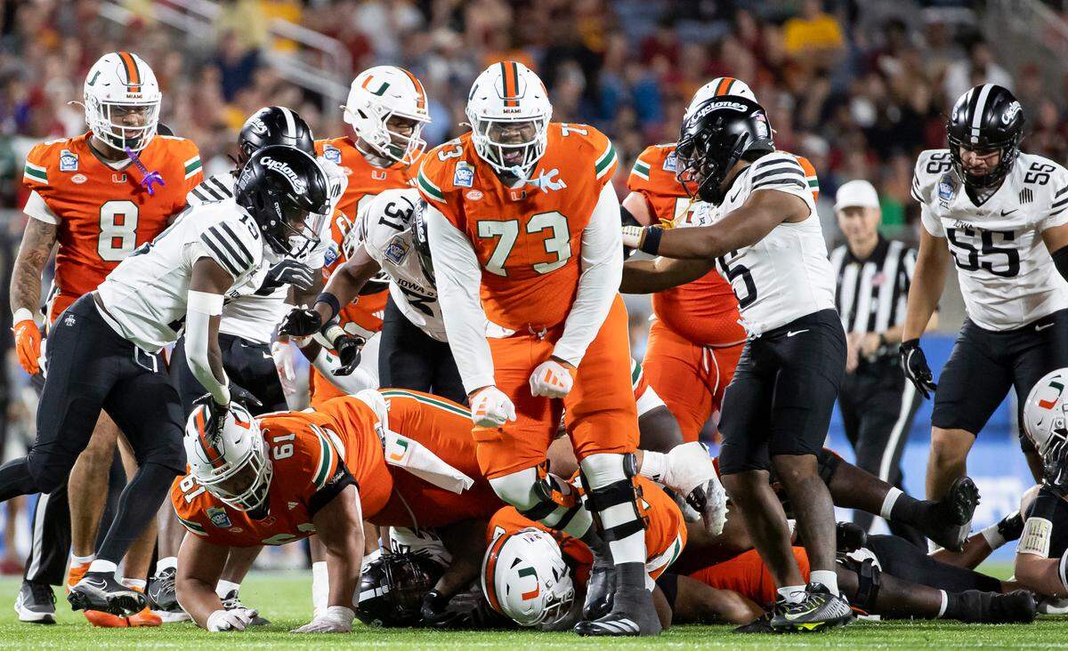 Miami Hurricanes offensive lineman Anez Cooper (73) reacts after a play against the Iowa State Cyclones in the second half of their Pop-Tarts Bowl football game at the Camping World Stadium on Saturday, Dec. 28, 2024, in Orlando, Fla.