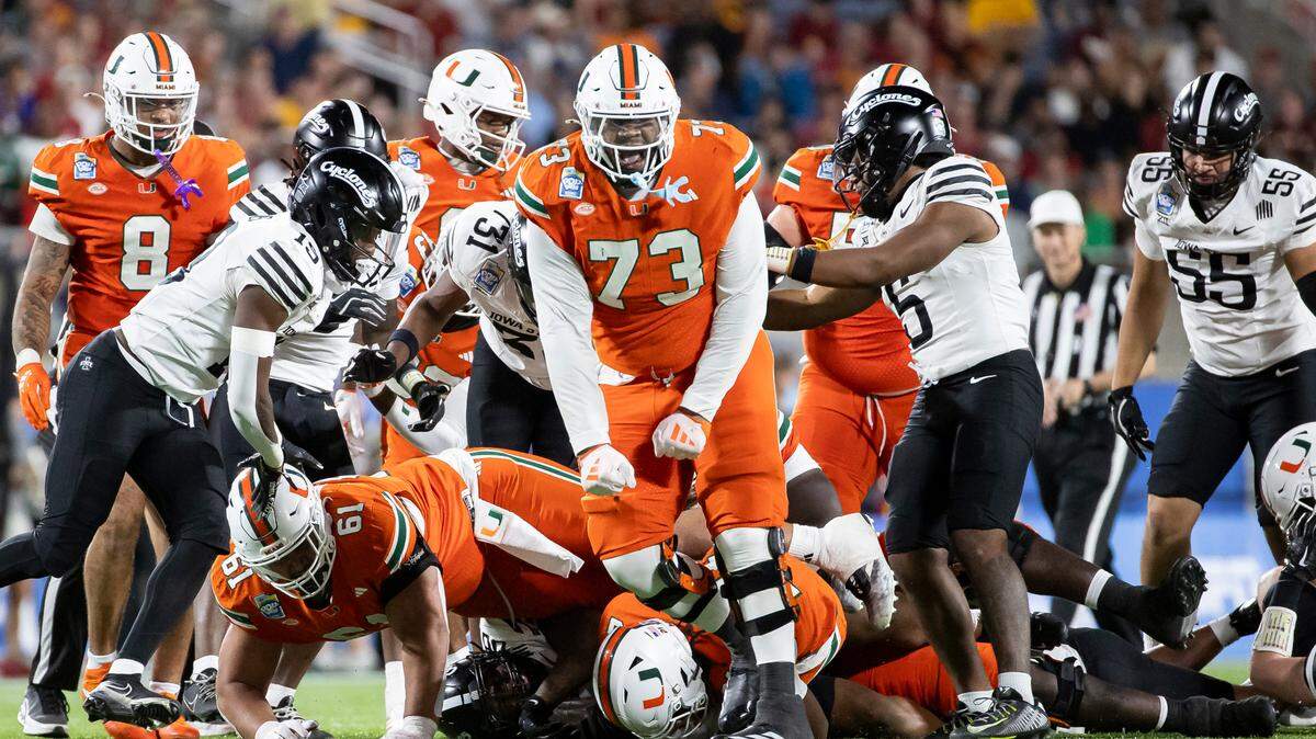 Miami Hurricanes offensive lineman Anez Cooper (73) reacts after a play against the Iowa State Cyclones in the second half of their Pop-Tarts Bowl football game at the Camping World Stadium on Saturday, Dec. 28, 2024, in Orlando, Fla.
