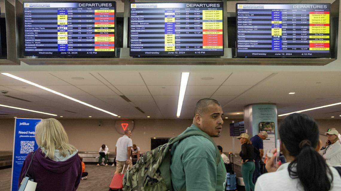 FILE - James Rodriguez talks with his wife, Diana, after their flight to Cancun was canceled at the Fort Lauderdale-Hollywood International Airport due to heavy downpours across South Florida on Wednesday, June 12, 2024 in Fort Lauderdale, Fla.