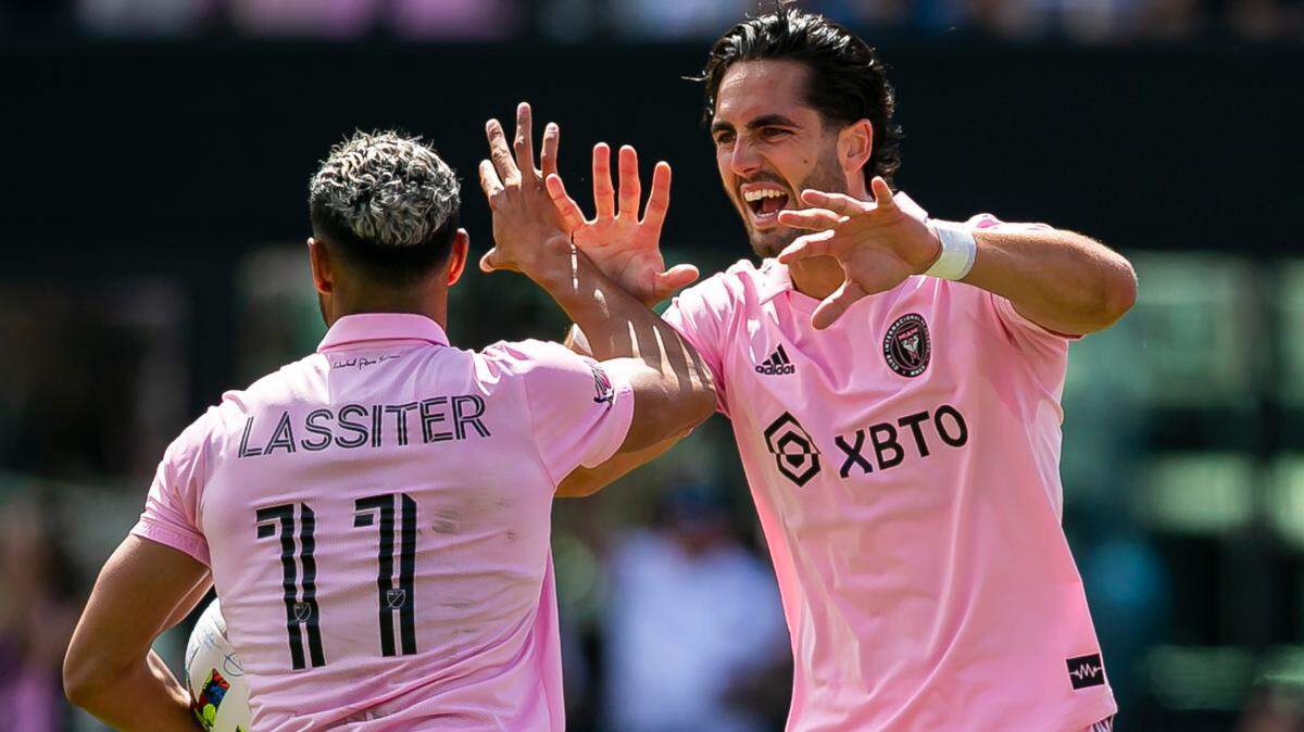 Inter Miami forwards Ariel Lassiter (11) and Leonardo Campana (9) celebrate after scoring a goal against New England Revolution during the first half of their MLS soccer match at DRV PNK Stadium on Saturday, April 9, 2022, in Fort Lauderdale, Florida.