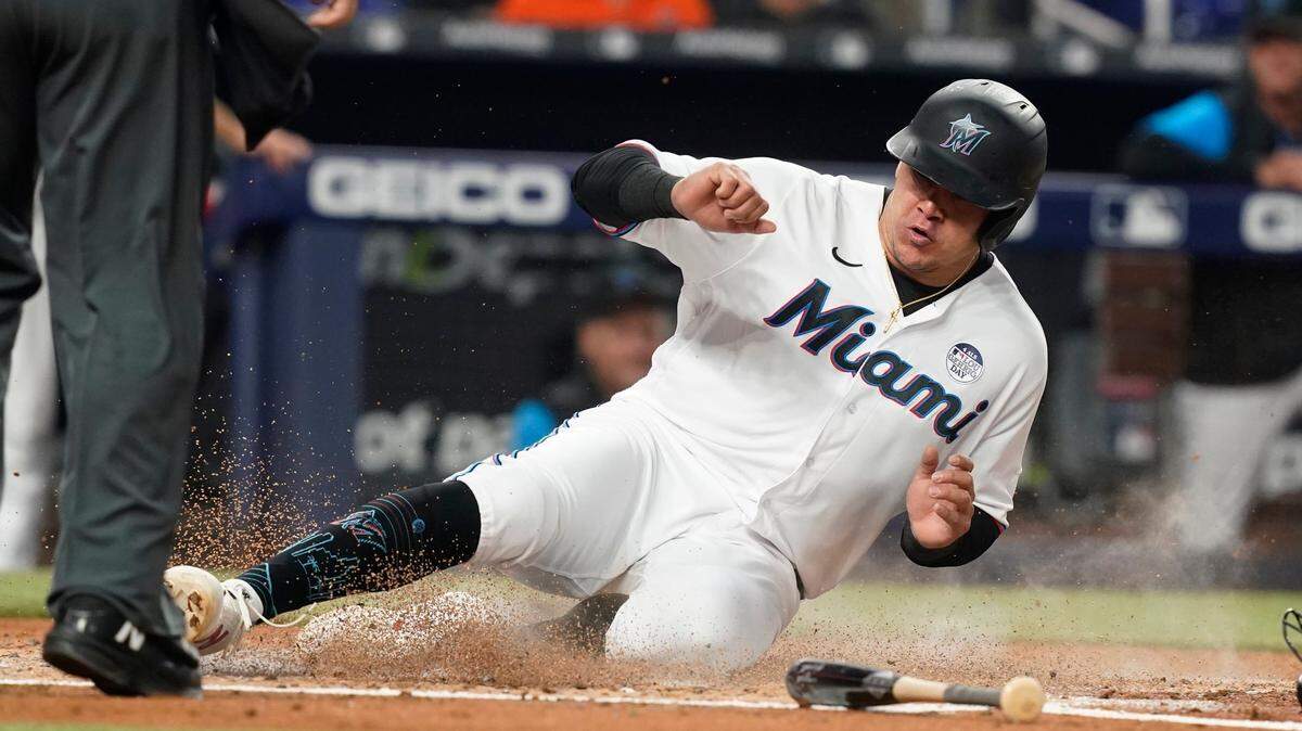 Miami Marlins Avisail Garcia scores on a hit by Jacob Stallings during the second inning of a baseball game against the San Francisco Giants, Thursday, June 2, 2022, in Miami.
