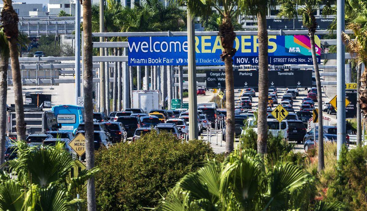 Long line of vehicles seen bumper to bumper heading into the Miami International Airport ahead of the Holidays in Miami, on Friday, November 21, 2025.