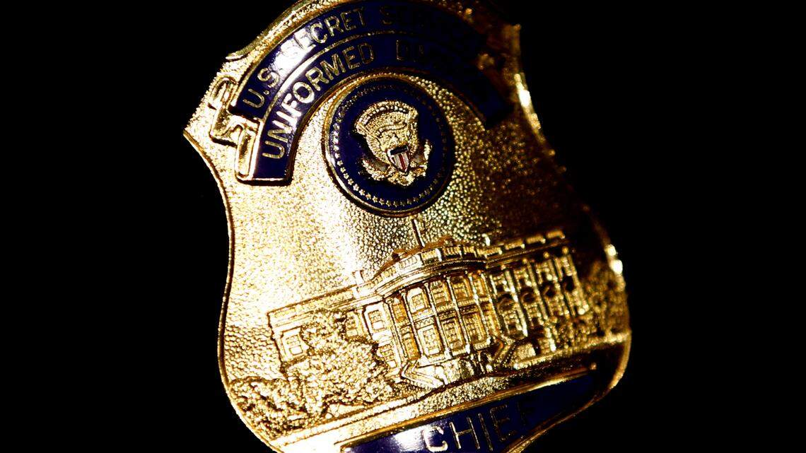 In this stock photo, a U.S. Secret Service Uniformed Division shield is seen on the jacket of an officer on Capitol Hill in Washington, D.C., in May 2012. Two men are accused of impersonating Homeland Security federal agents and one allegedly offered gifts to Secret Service members, one protecting Jill Biden.