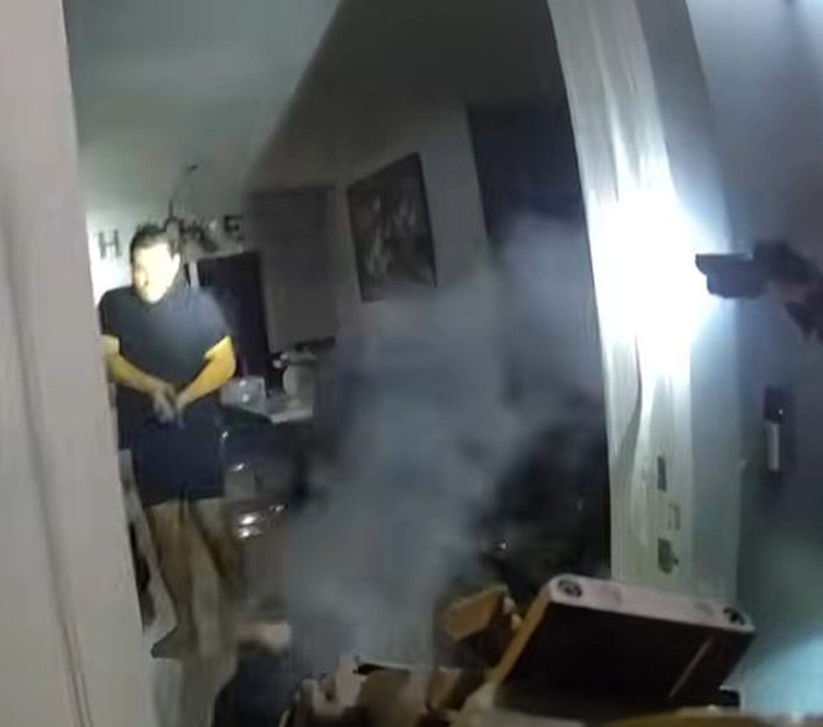 Miami-Dade Sheriff’s Office deputies confront an armed Christopher Barata during a Dec. 2, 2025, search-warrant raid. Deputies fatally shot Barata. The raid was part of a child-pornography investigation into Barata’s brother, according to the sheriff’s office.