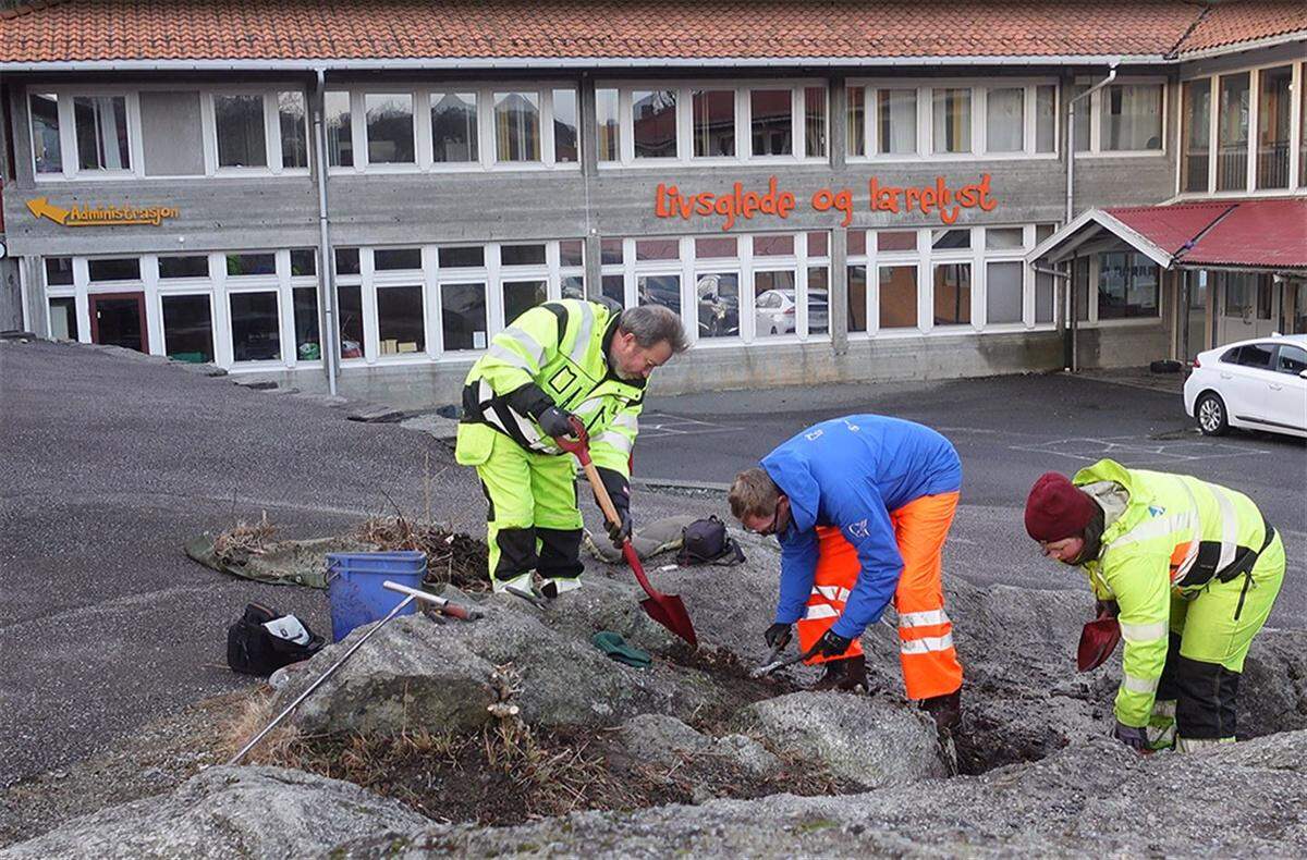 Archaeologists excavate part of the schoolyard.