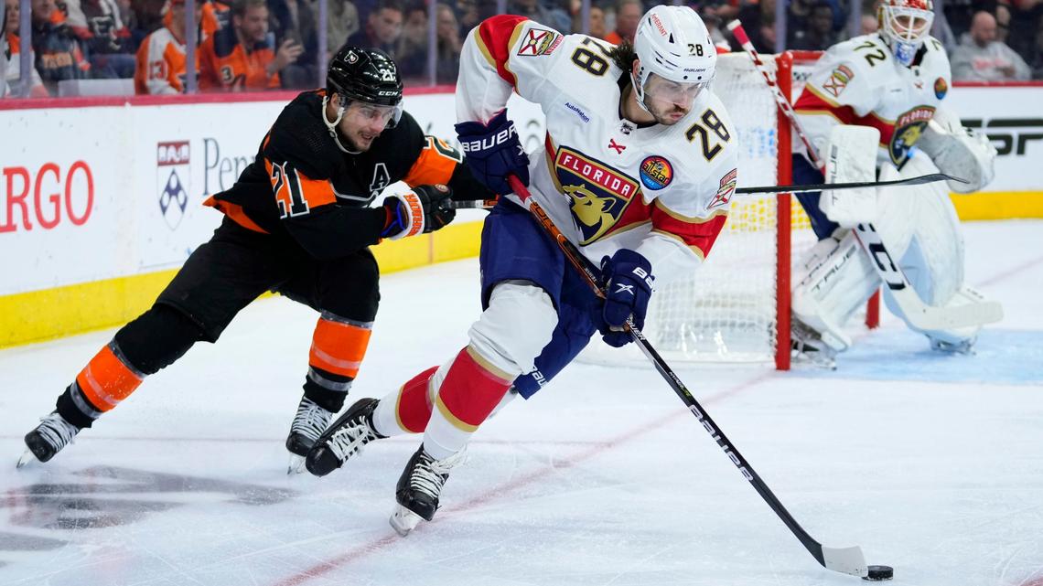 Florida Panthers’ Josh Mahura, right, skates away from Philadelphia Flyers’ Scott Laughton during the second period of an NHL hockey game, Thursday, Oct. 27, 2022, in Philadelphia.