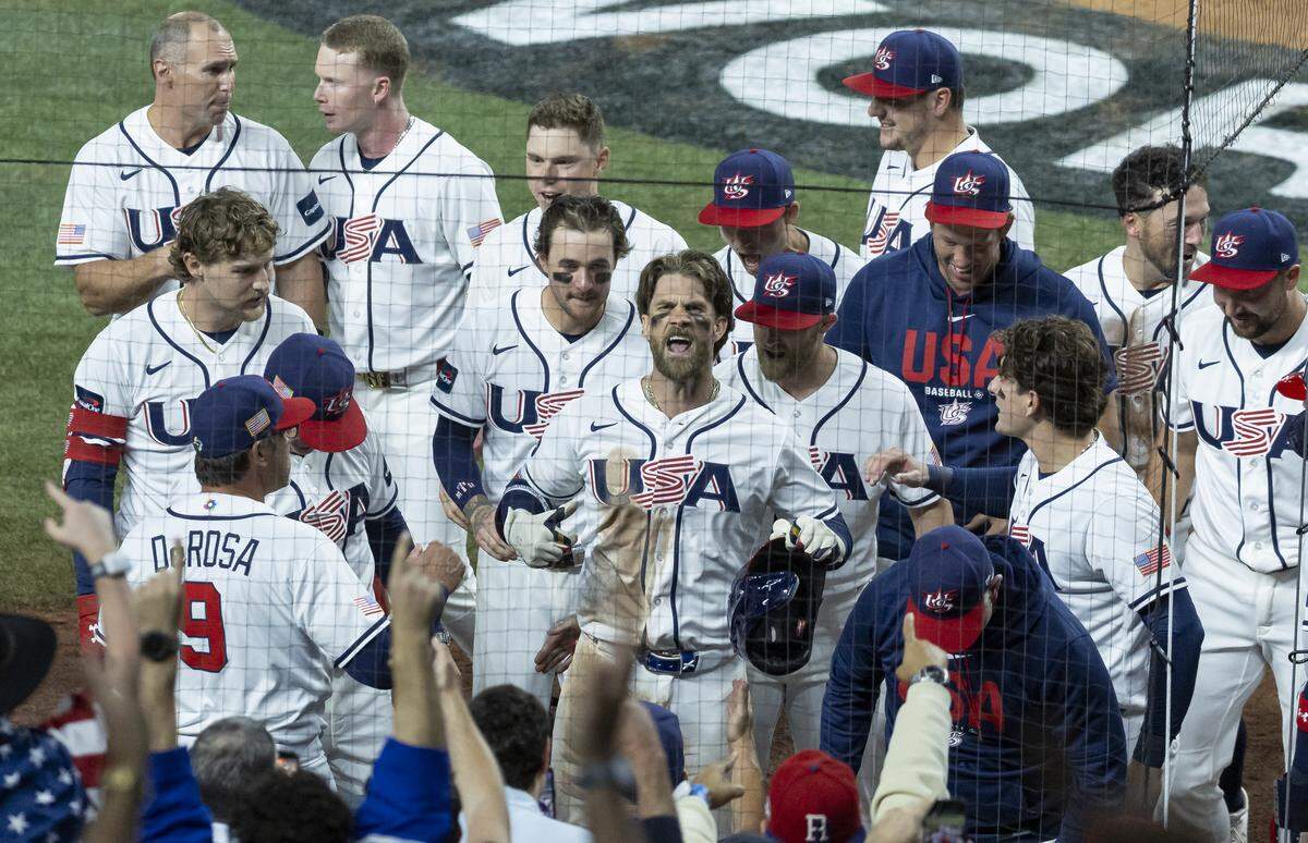 United States first baseman Bryce Harper (24) celebrates with his teammates after hitting a home run against Venezuela in the eighth inning of their World Baseball Classic final game at loanDepot Park on Tuesday, March 17, 2026, in Miami, Fla.