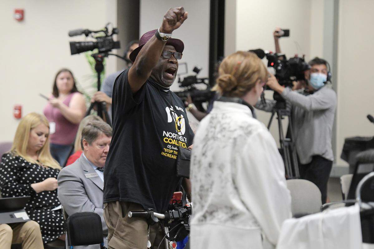 FILE - Ben Frazier, the founder of the Northside Coalition of Jacksonville chants “Allow teachers to teach the truth” at the end of his public comments opposing the state of Florida’s plans to ban the teaching of critical race theory in public schools during the Department of Education meeting Thursday, June 10, 2021. Critical race theory has become a lightning rod for Republicans and an issue in some Election Day races around the country. (Bob Self/The Florida Times-Union via AP, File)