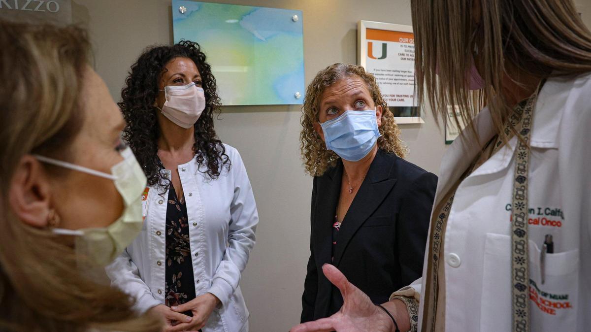 U.S. Rep. Debbie Wasserman Schultz, second from right, speaks with Dr. Carmen Calfa, right, a breast cancer oncology specialist, and others during a tour of the Sylvester Comprehensive Cancer Center at the University of Miami on Tuesday, March 14, 2023, in Miami. Wasserman Schultz has reintroduced a bill in Congress to expand genetic testing for Medicare beneficiaries.