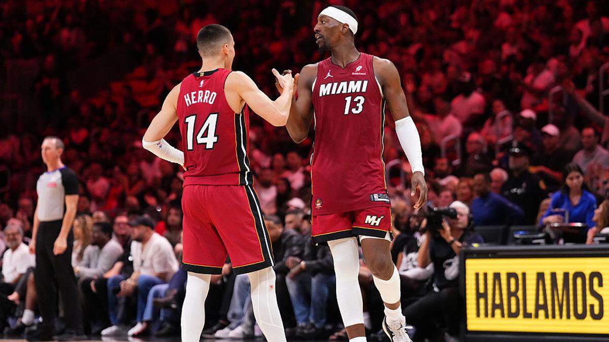 Bam Adebayo #13 celebrates with Tyler Herro #14 of the Miami Heat after scoring a three-pointer against the Detroit Pistons during the second quarter at Kaseya Center on March 08, 2026 in Miami.