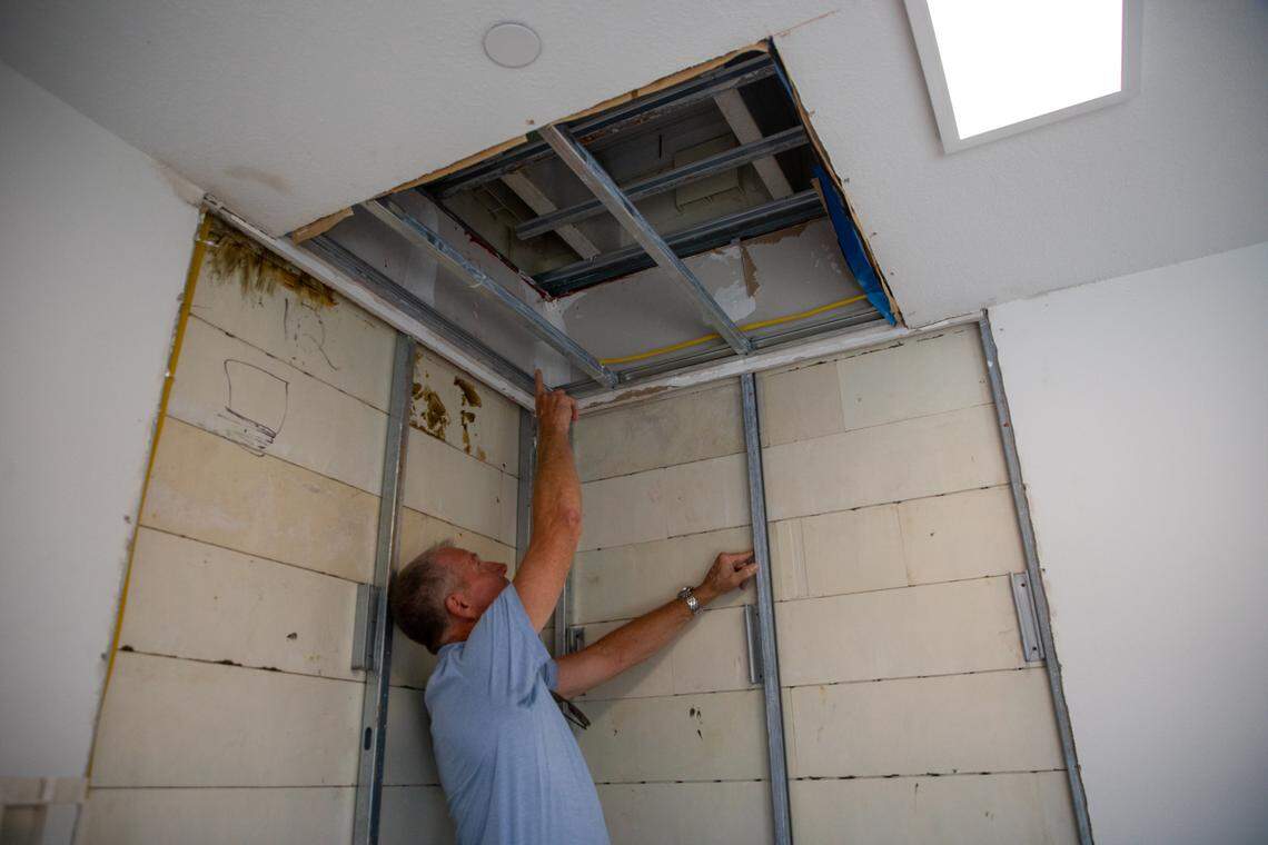 Kenneth ​​​Smuts, the president of RENCO, shows an exposed part of the building that shows how the blocks stack together like LEGOS and are reinforced by steel beam decking.