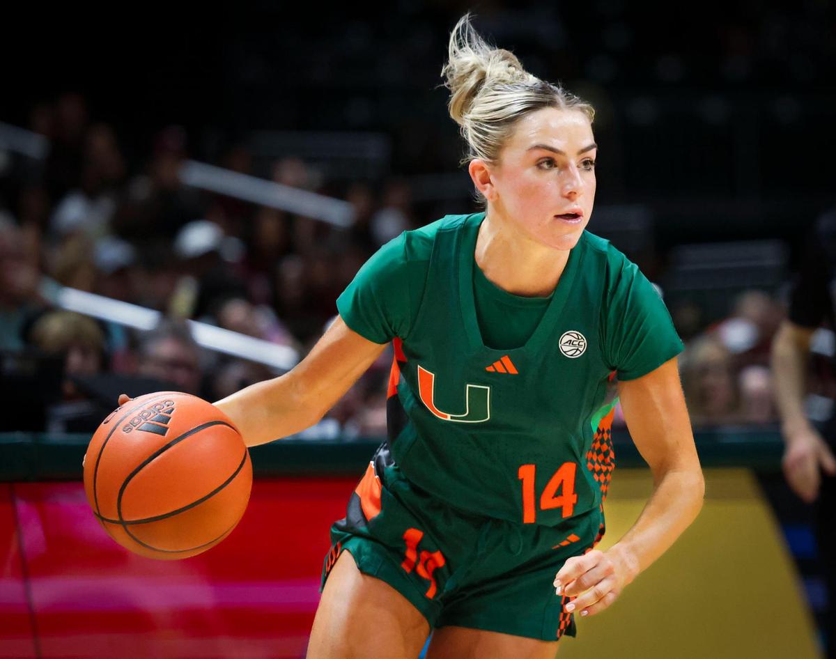 Miami Hurricanes guard Haley Cavinder (14) drives the ball during the third quarter of a game against the Florida State Seminoles on Sunday, Feb. 16, 2025, at Wastco Center in Coral Gables, Fla.
