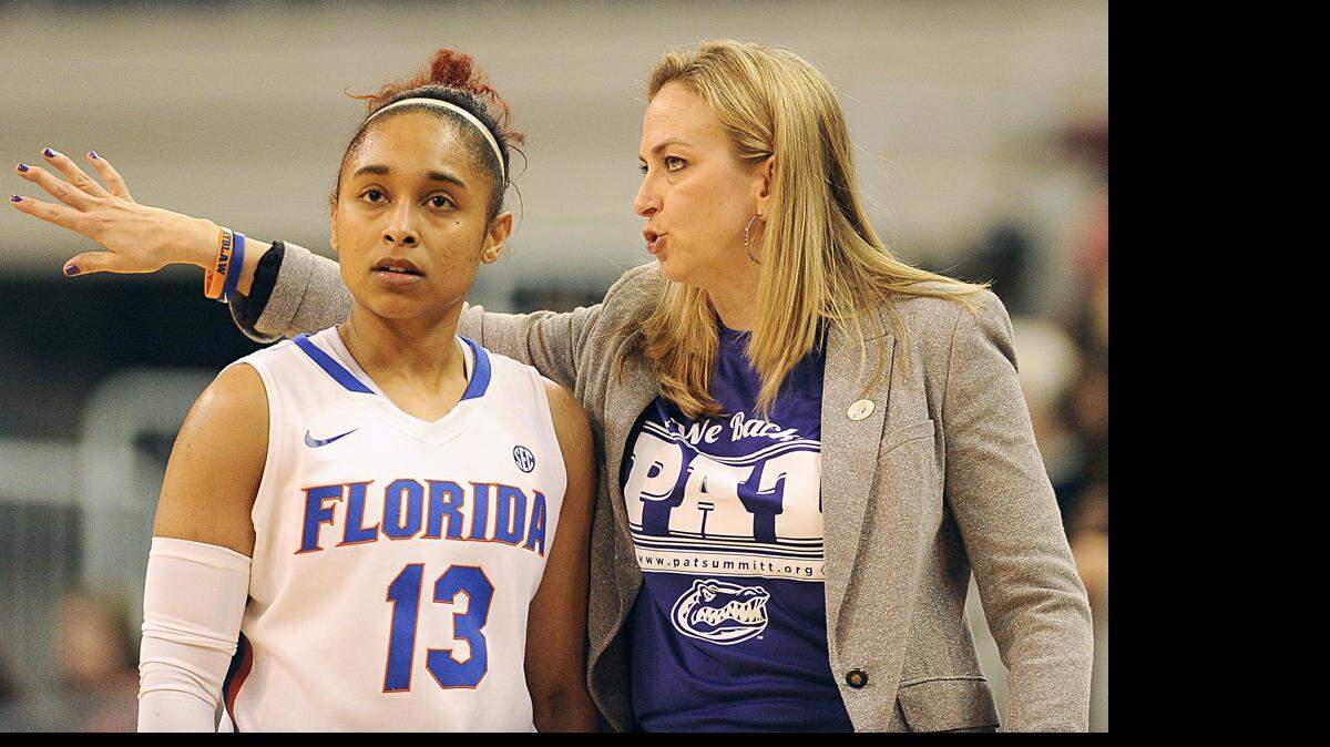 Florida coach Amanda Butler, right, talks with Florida guard Cassie Peoples (13) during the first half of an NCAA college basketball game against South Carolina in Gainesville, Fla., Monday, Jan. 19, 2015.