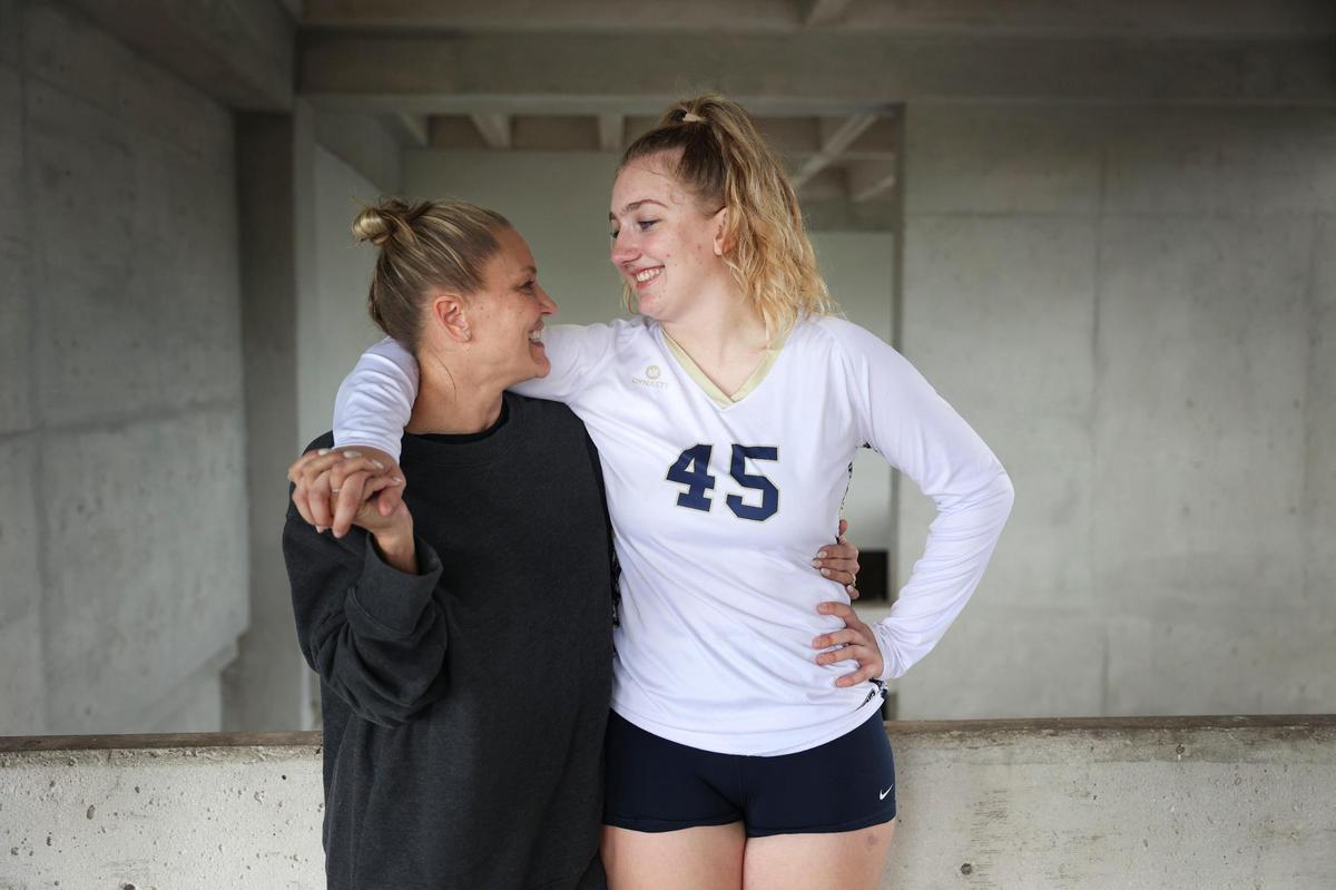 Deven Gonzalez, right, senior volleyball player for Miami High who suffered injuries to her left leg in the Surfside collapse, poses with her mother, Angela, for a portrait between matches on Tuesday, Oct. 4, 2022, at Miami Dade College campus in Kendall. Gonzalez lost her father in the collapse as well. “[Playing volleyball] was just another loss that I was not going to allow her to experience, not right now anyway,” said Angela.