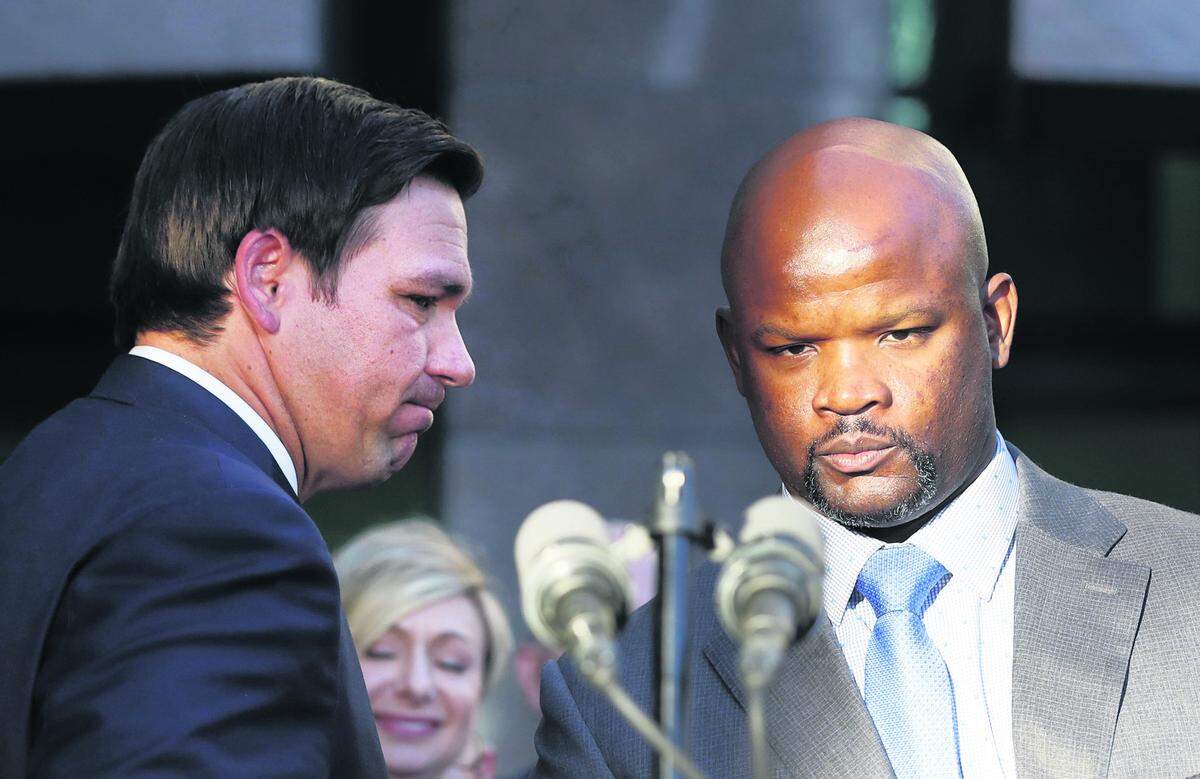 Florida Gov. Ron DeSantis, left, introduces acting sheriff Gregory Tony at the Broward County Sheriff’s Office Fort Lauderdale headquarters on Friday, Jan. 11, 2019. DeSantis suspended Sheriff Scott Israel over his handling of the Feb. 14, 2018, massacre at Marjory Stoneman Douglas High School.