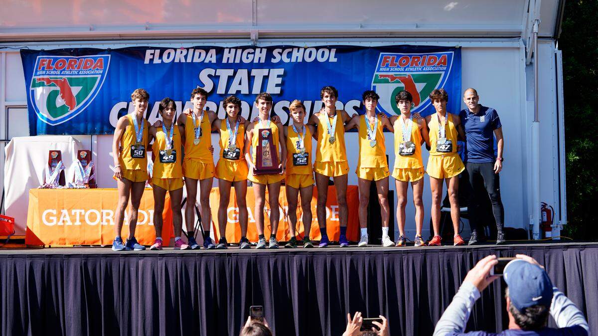 The Belen Jesuit cross country team poses after winning the 2019 Class 3A FHSAA state cross country championship.