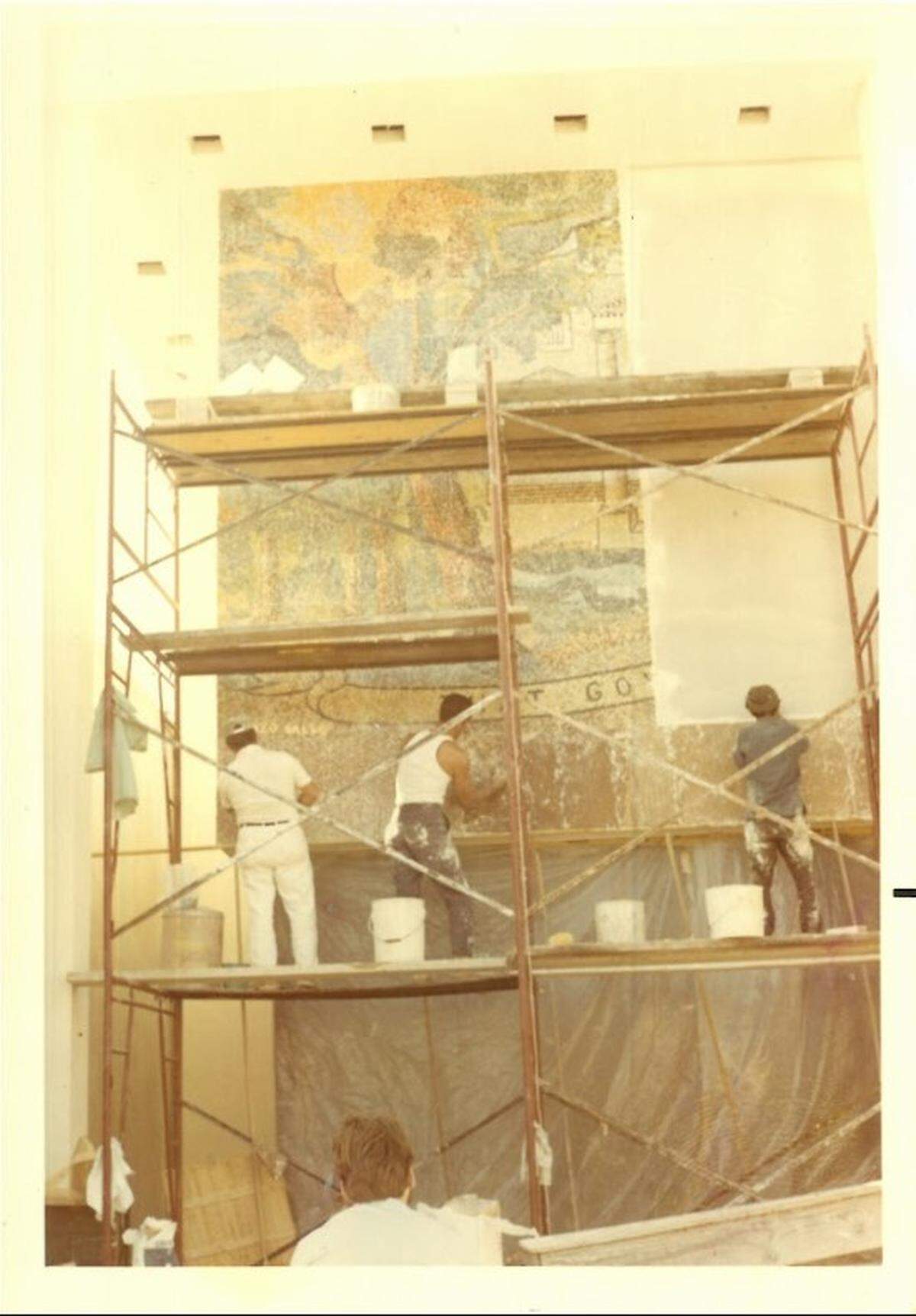 Archival photo shows the creation of the Enzo Gallo murals in Miami Beach. The artwork was completed in 1971 and displayed on the former American Savings and Loan building at the corner of Lincoln and Alton roads.