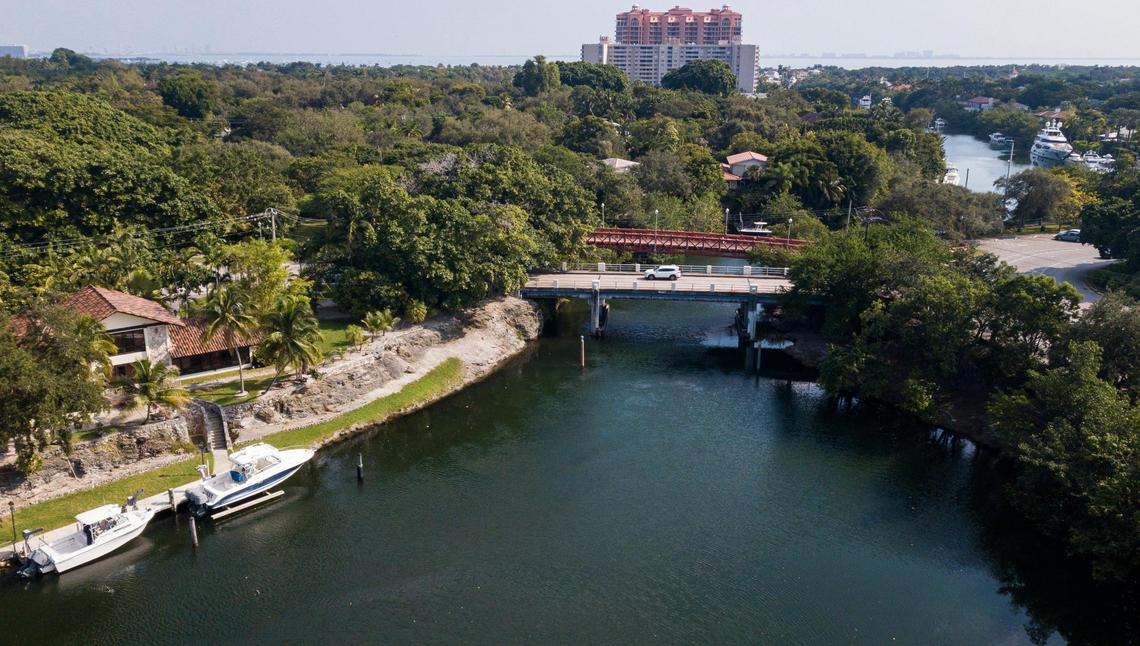 The Coral Gables Waterway carves a path between two small limestone cliffs near Cocoplum Circle, where the canal cuts through the Atlantic Coastal Ridge.