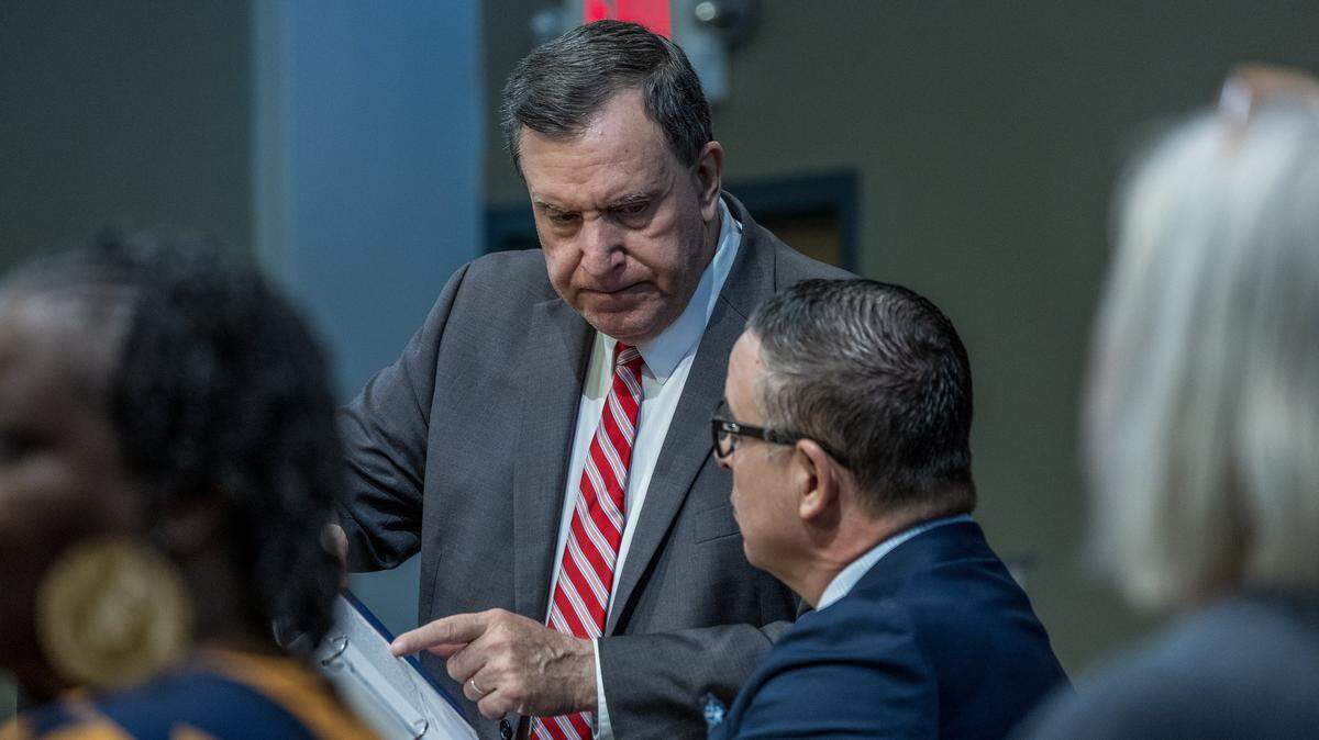 City of Miami Commissioner Joe Carollo (left), talks with City Manager Art Noriega, during a Commission meeting to discuss the proposed sale of the Olympia Theater at the Gusman Center for the Performing Arts' entire building to a public charter school, called Sports Leadership Arts Management, (SLAM), at City Hall, on Thursday September 25, 2025.