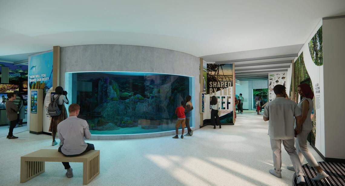 A rendering shows visitors looking at exhibits, including a 23,000-gallon fish tank at the Discovery Center & Aquarium scheduled to open at John Pennekamp Coral Reef State Park in 2028.